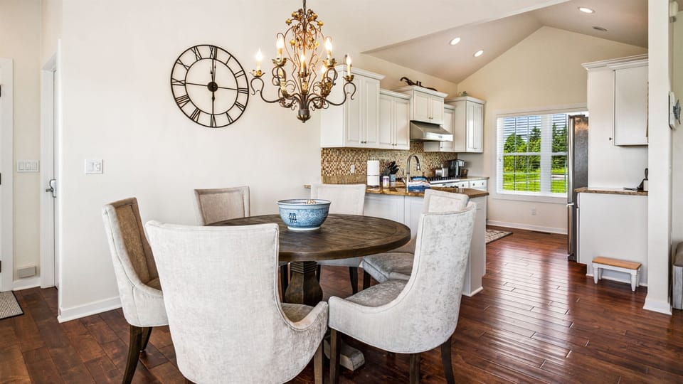 An open dining and kitchen space designed for gathering—easy flow, great conversation, and meals that turn into memories.