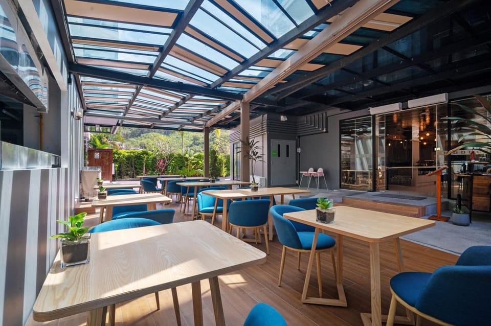Stylish outdoor dining area with comfortable seating and natural light.