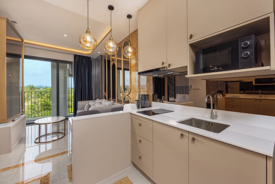Suite, Balcony, Lagoon View | Private kitchen | Coffee/tea maker, electric kettle, toaster, dining tables