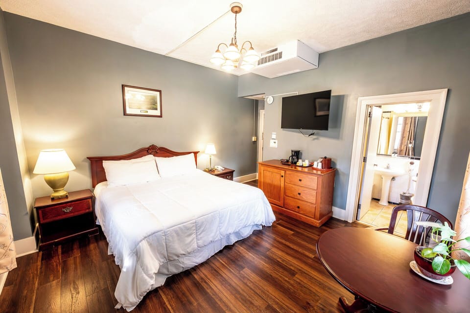 Unwind in a bright room with TV and cozy seating.
