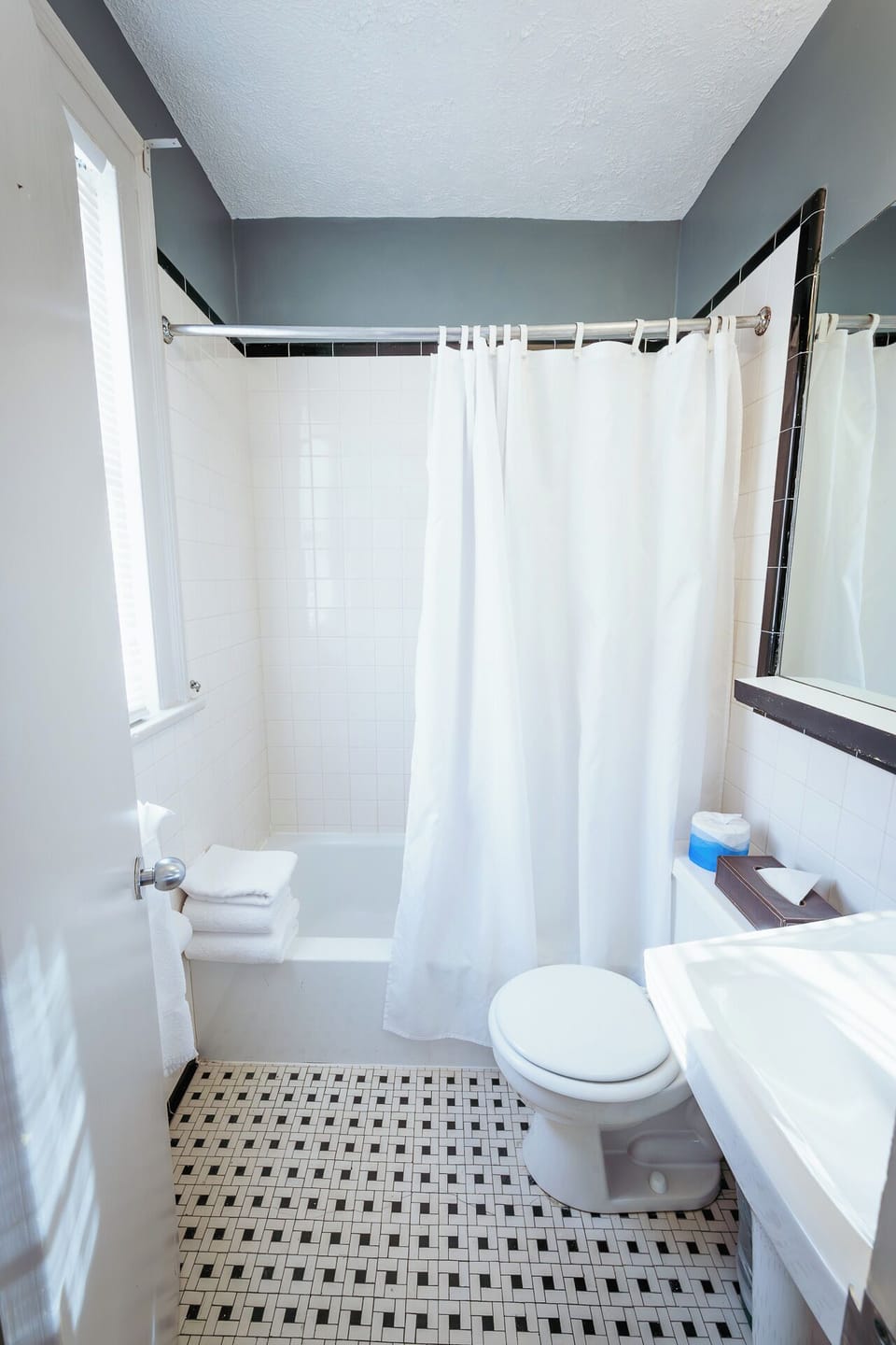 Start your day in a sunlit bathroom with fresh towels.