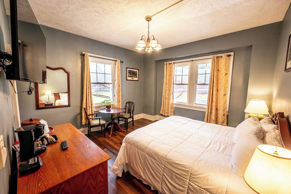 Unwind in a spacious king room with cozy sitting nook.