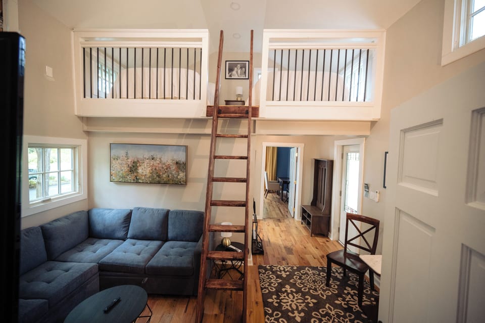 Enjoy the airy lofted space with cozy seating below