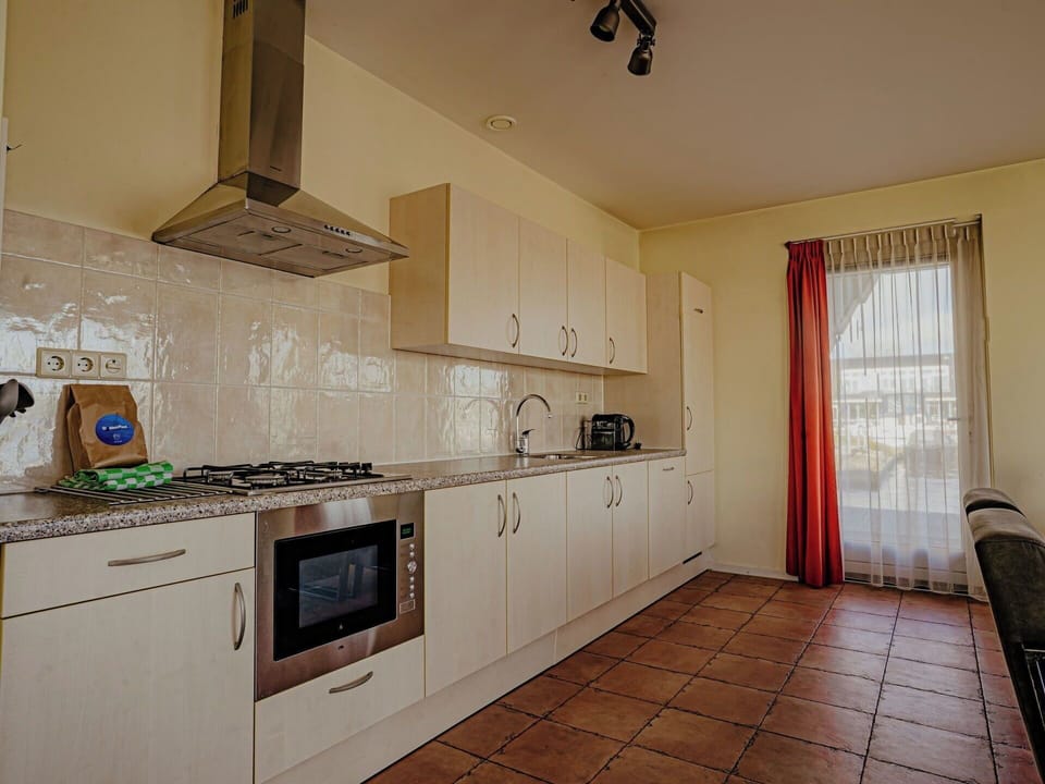Flooring, Floor, Ceiling, Interior Design, Room, Cabinetry, Countertop, Kitchen, Wood Stain, Major Appliance