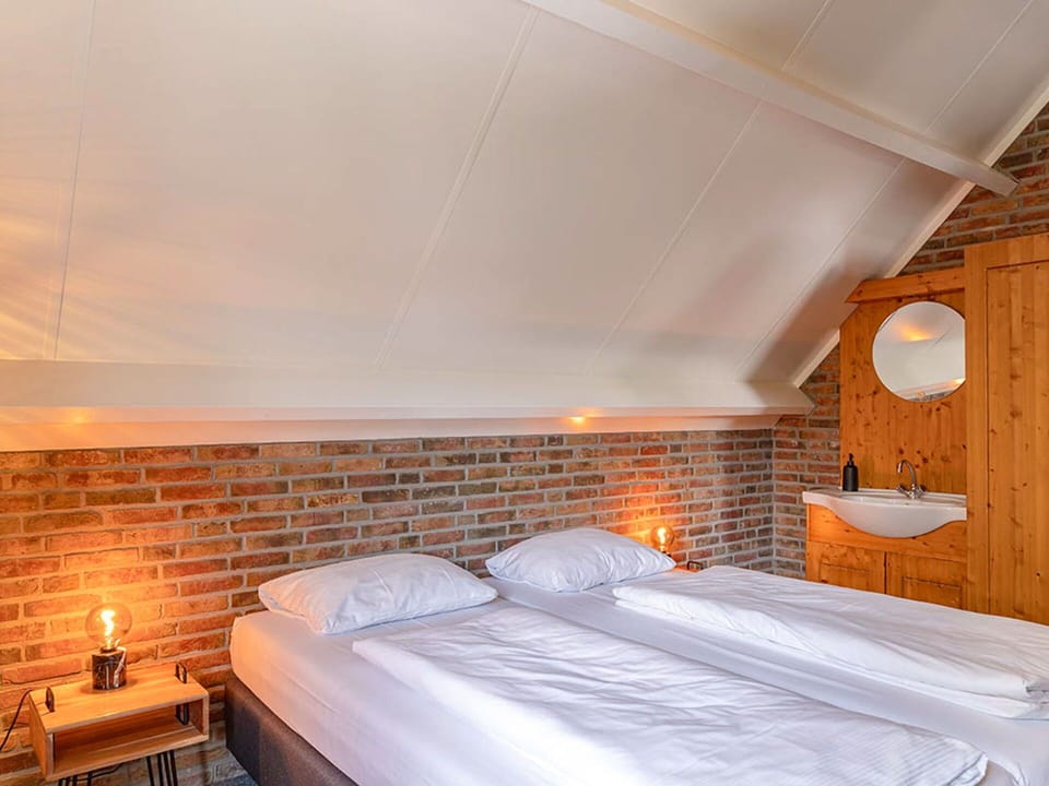 Brick, Brickwork, Bedroom, Bed Frame, Lamp, Bedding, Light Fixture, Bed, Wood Stain, Hotel