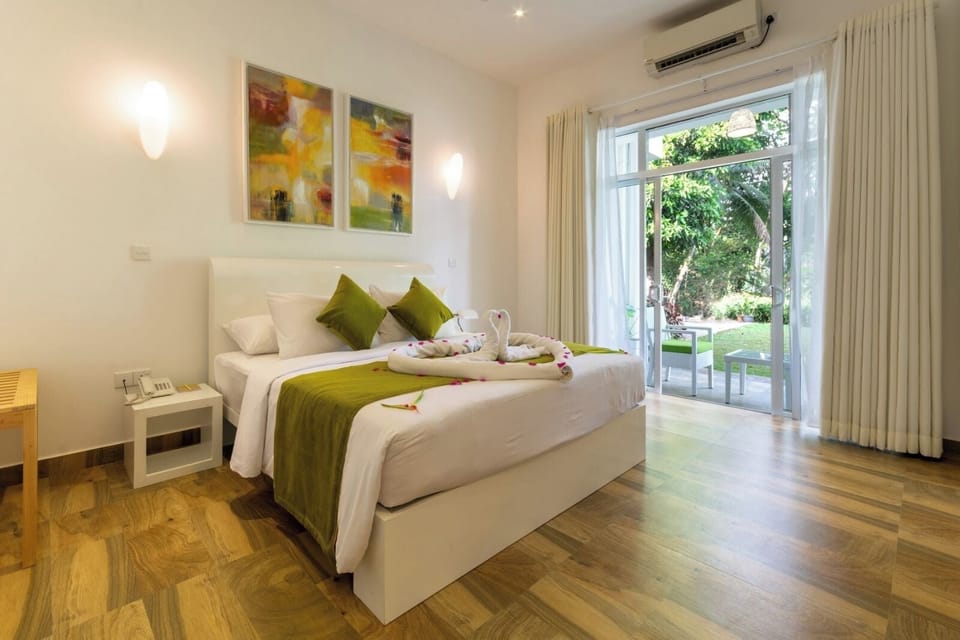 Luxury Suite, River View | In-room safe, blackout drapes, iron/ironing board, free WiFi