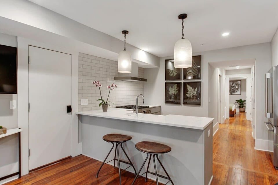 Kitchen | Kitchen with Island and Natural Light | First Floor of Building — Unit on One Level