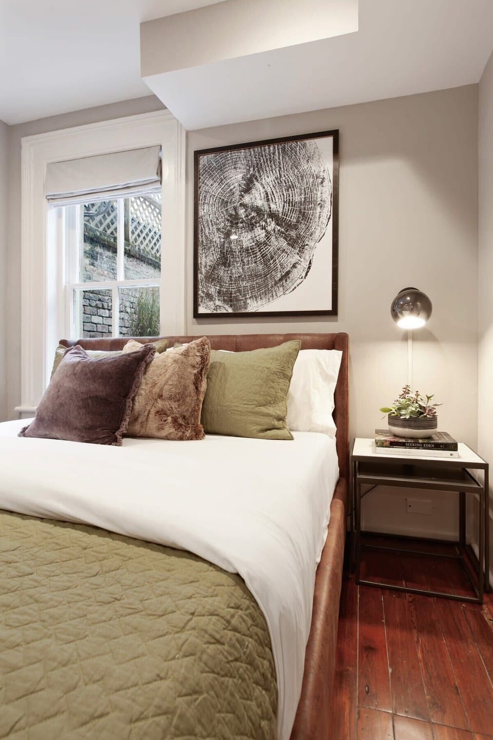 Bedroom 1 | Queen Bed and Single Bed with Natural Light and Jack and Jill Bathroom Access | First Floor of Building — Unit on One Level