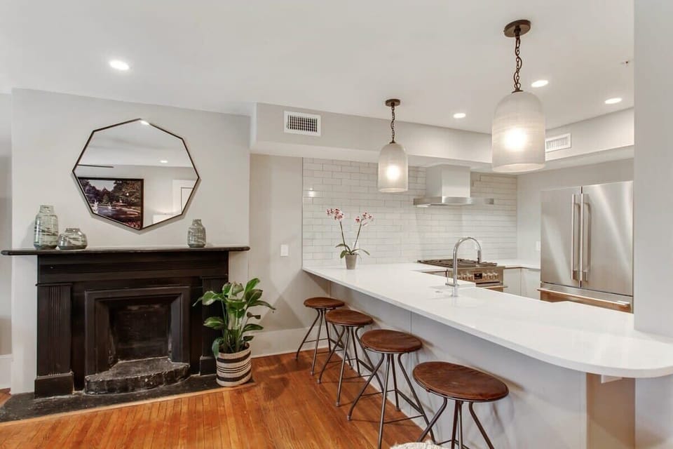  Kitchen | Open Concept Kitchen with Island and Bar Seating | First Floor of Building — Unit on One Level