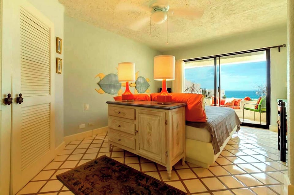  Second bedroom with king-size bed and ocean views.