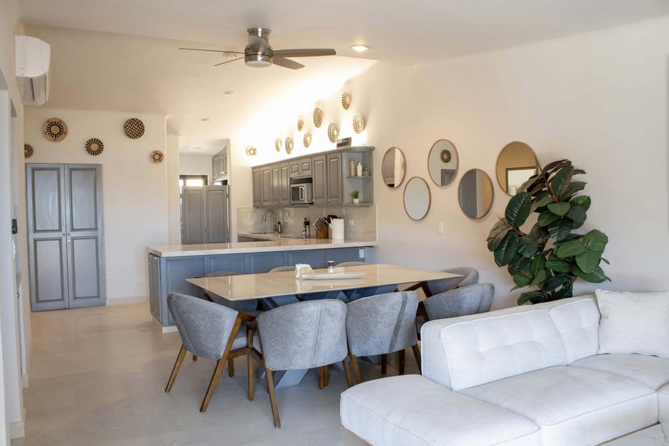 A spacious, light-filled layout connecting the kitchen and lounge.