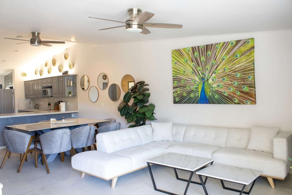 Relax on the plush white sectional in the stylish living room.