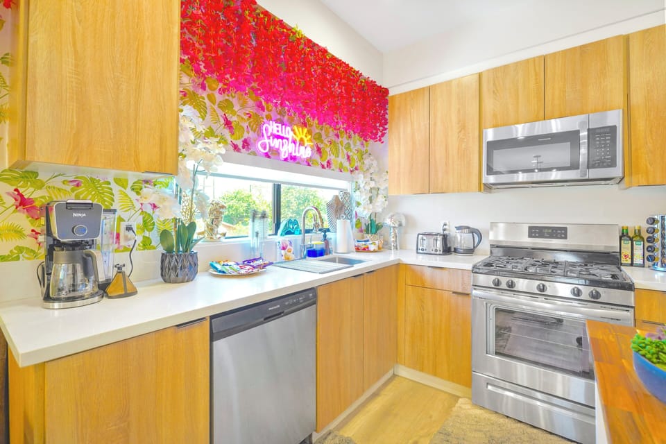 Cook in a fully equipped kitchen with sleek appliances and ample space.