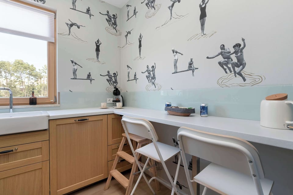 The kitchen's contemporary decor complements the apartment's style.