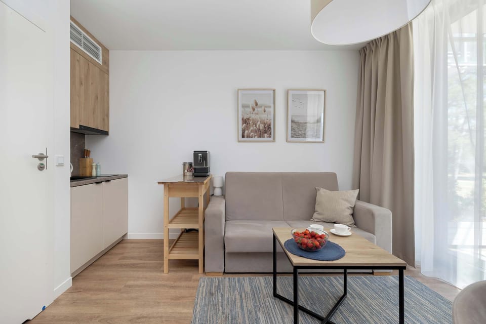 The living area's modern and stylish decor creates a welcoming atmosphere.