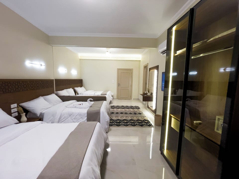 Family Quadruple Room, Mountain View | Minibar, free WiFi, bed sheets