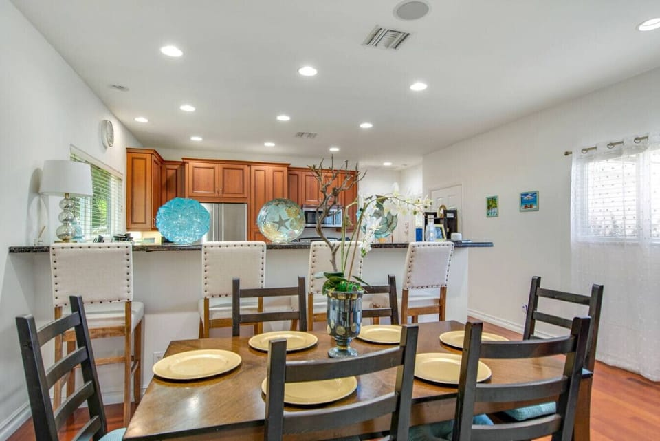 This inviting dining room offers seating for six, making it the ideal spot for meals or gathering with friends.