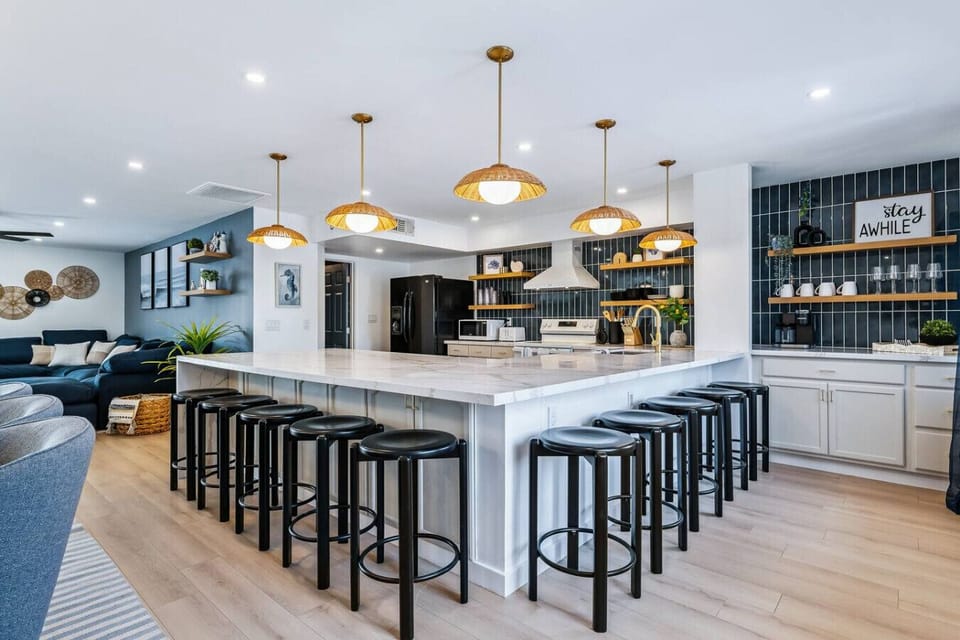 Fully stocked kitchen with everything you need, plus a Keurig + drip coffee maker combo. Large island seating for 10 makes it perfect for gathering.