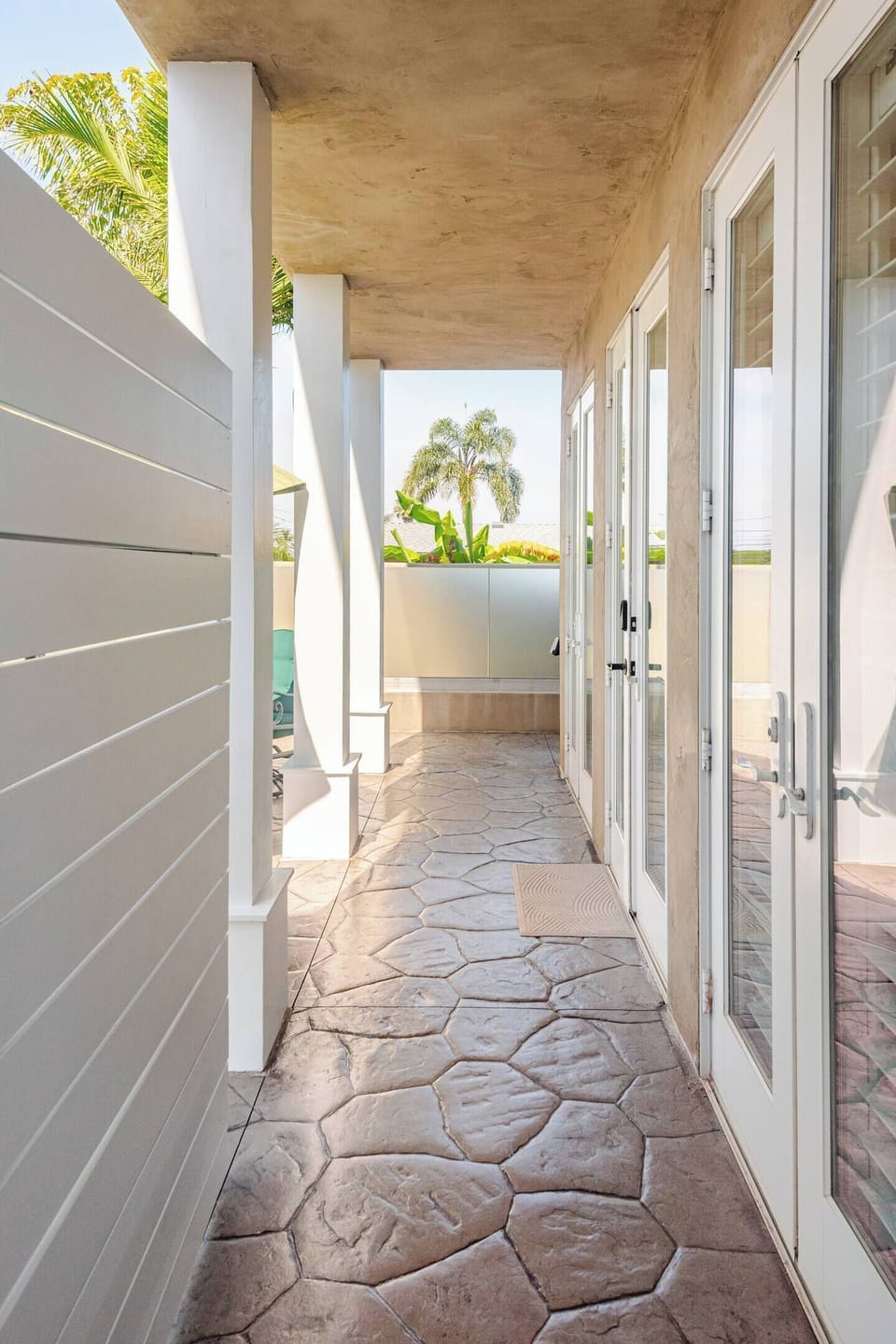 Private entrance leading to sunny patio