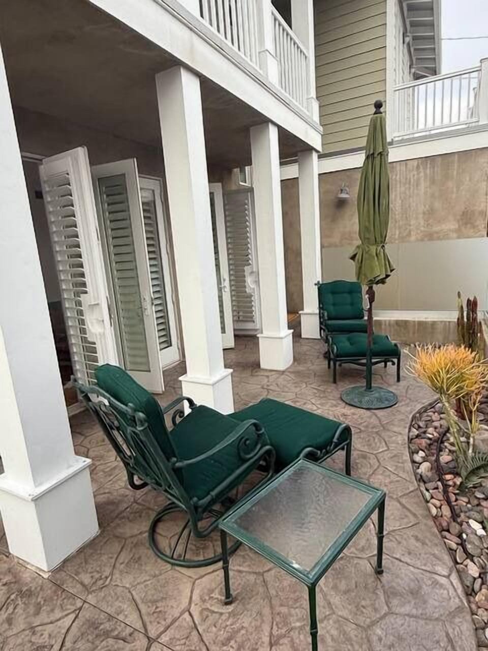 Cozy, shaded patio area perfect for morning coffee or evening wine