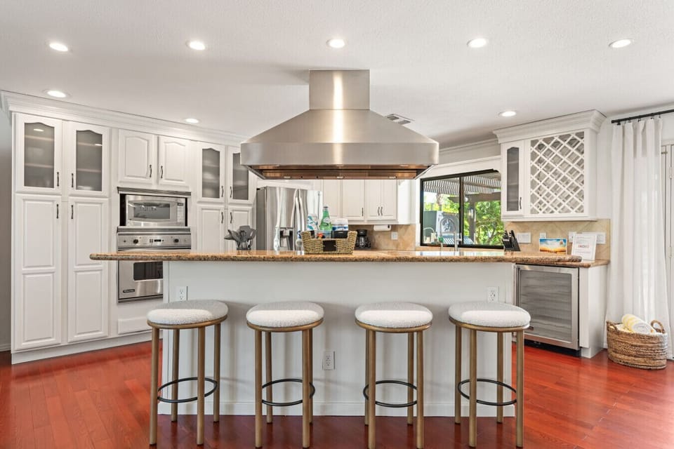 Spacious kitchen w/ island seating, stainless appliances & plenty of room to prep, cook & gather.