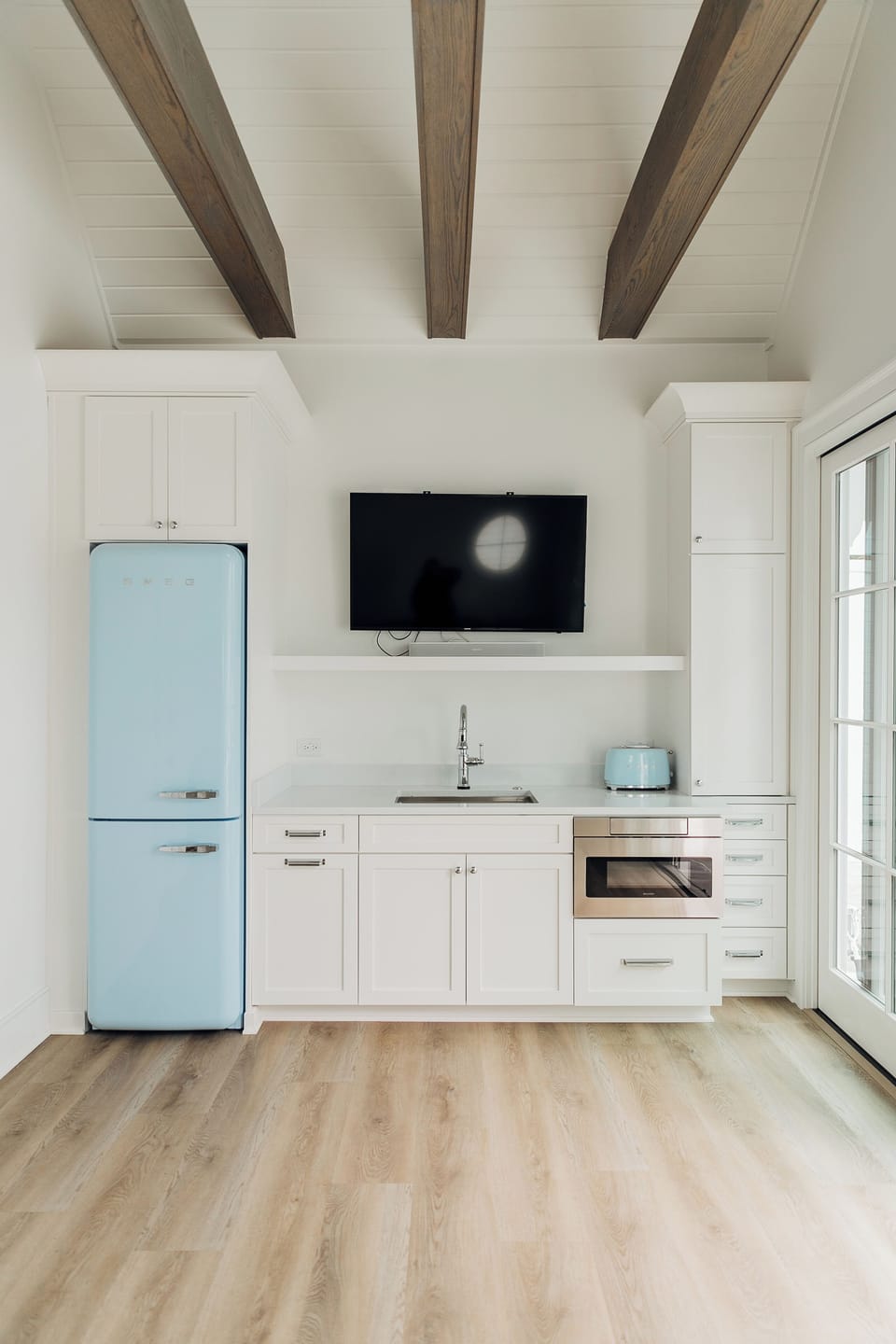 Living Room with Refrigerator, Sink/disposal, TV, Stereo, Toaster, and cupboards