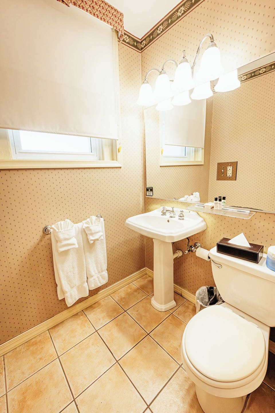 Refresh easily with bright vanity lighting and fresh towels provided.
