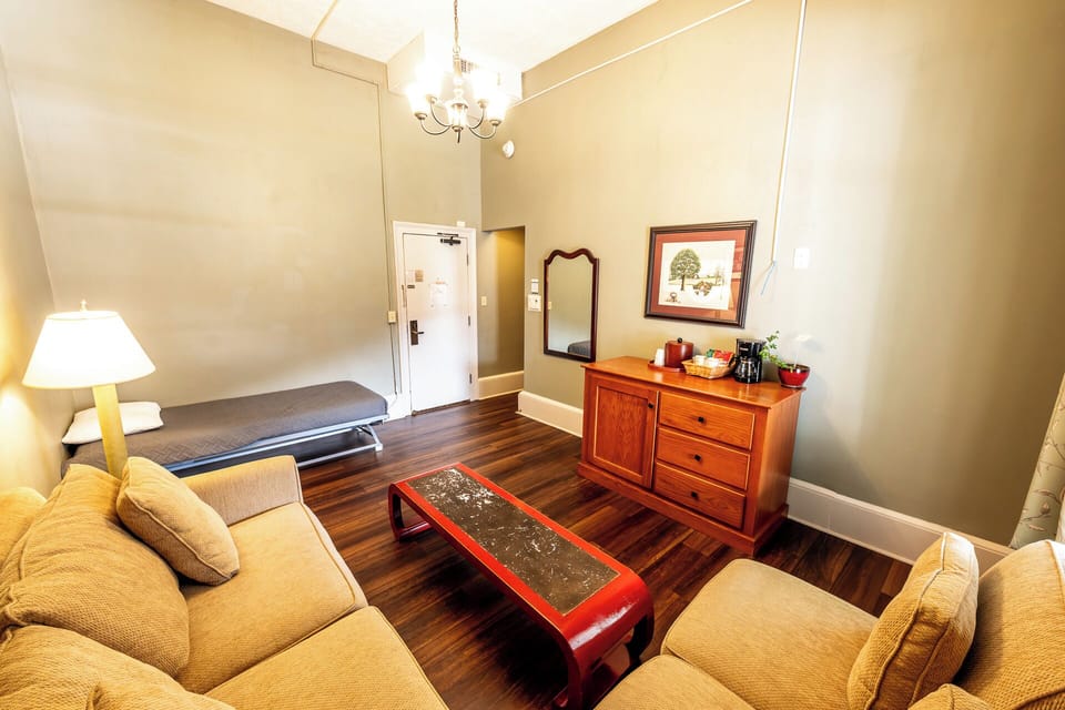 Settle in with a roomy seating area and convenient dresser storage.