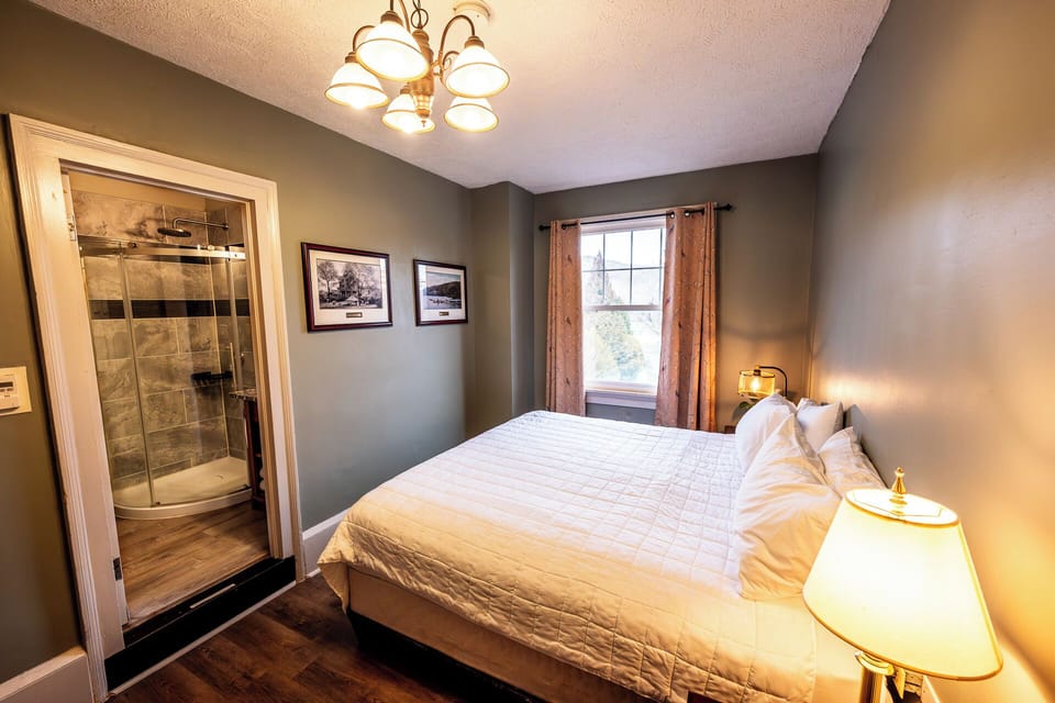 Unwind in a serene king bed with spa-style ensuite access