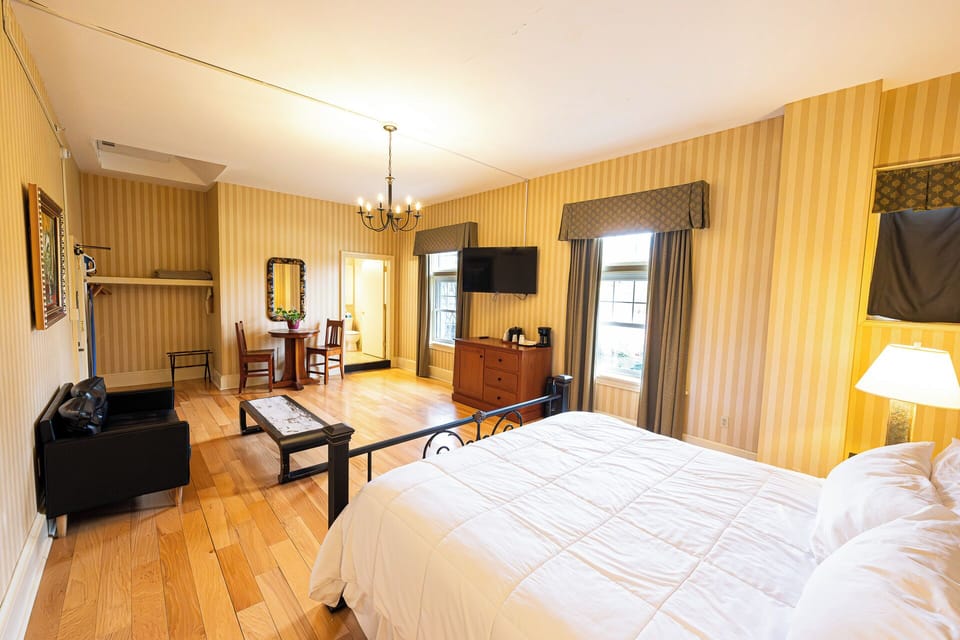 Drift off under warm lamplight in a cozy, classic bedroom.