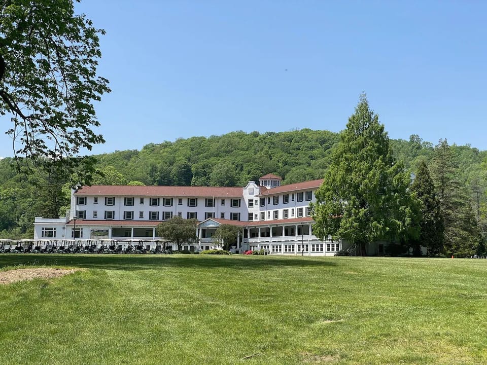 Stroll the expansive lawn to your classic hillside retreat.