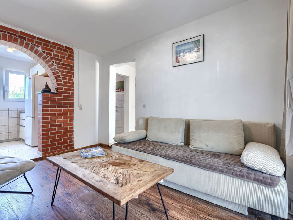 Furniture, Wall, Interior Design, Flooring, Couch, Floor, Room, Apartment, Home, Lighting