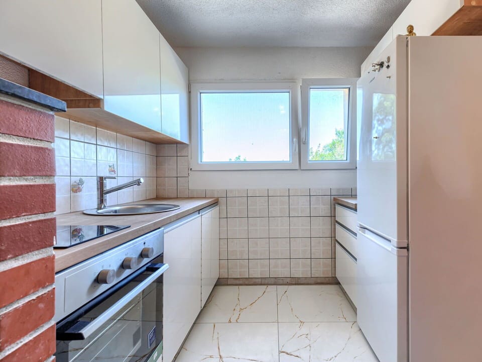 Kitchen, Countertop, Major Appliance, Flooring, Kitchen Appliance, Interior Design, Cabinetry, Floor, Kitchen Sink, Apartment