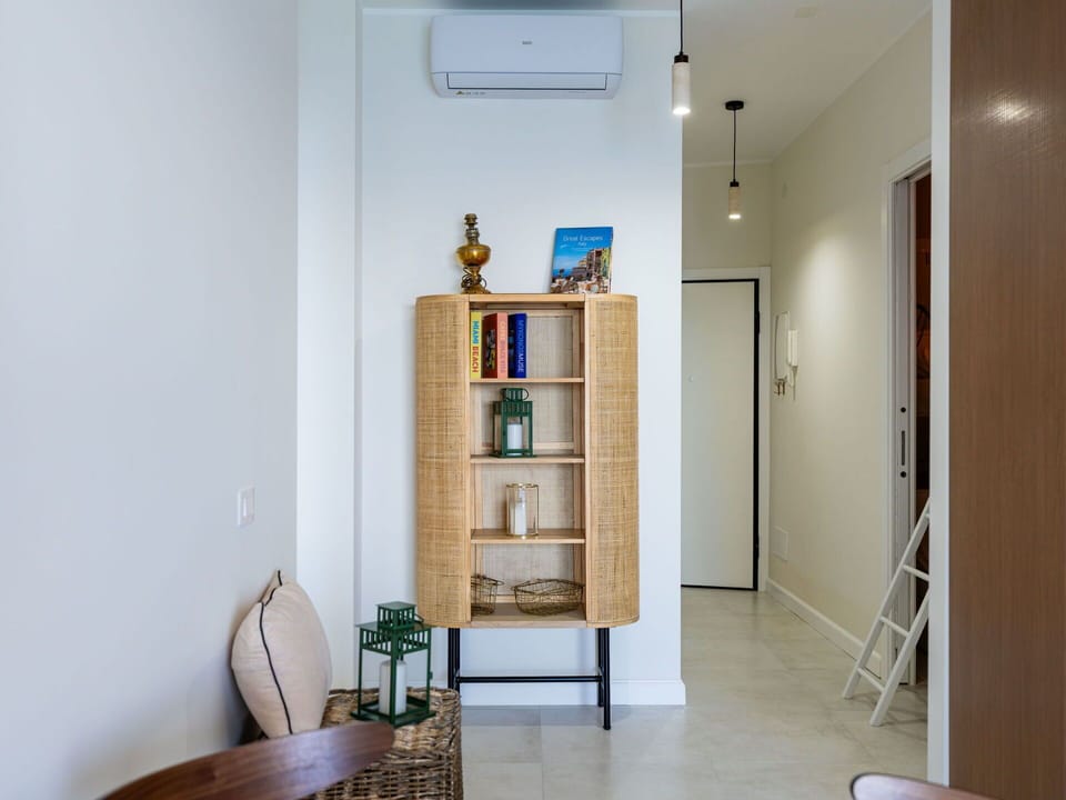 Furniture, Interior Design, Wall, Flooring, Shelving, Shelf, Wood, Floor, Lighting, Room