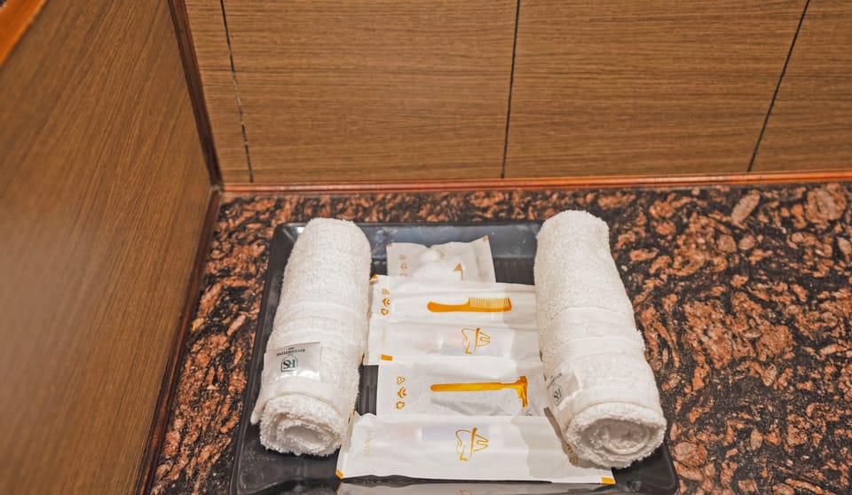 Premium bedding, desk, laptop workspace, blackout drapes