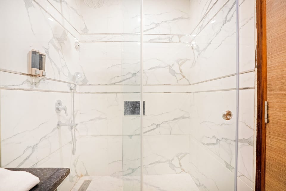 Shower, free toiletries, hair dryer, slippers