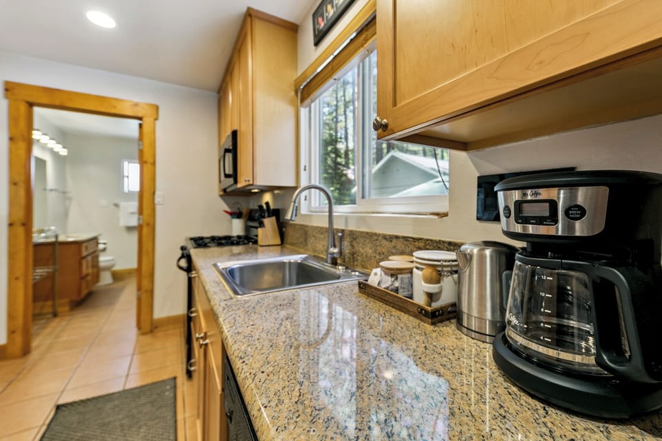 Your fully equipped kitchen features granite countertops, quality appliances, and everything needed to prepare meals during your stay.