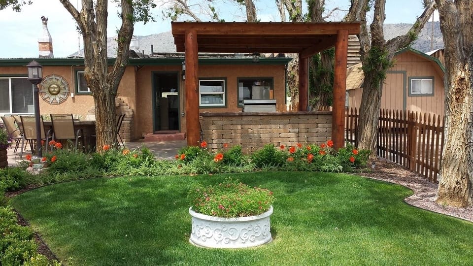 Unwind on manicured lawns surrounded by trees and quiet charm.