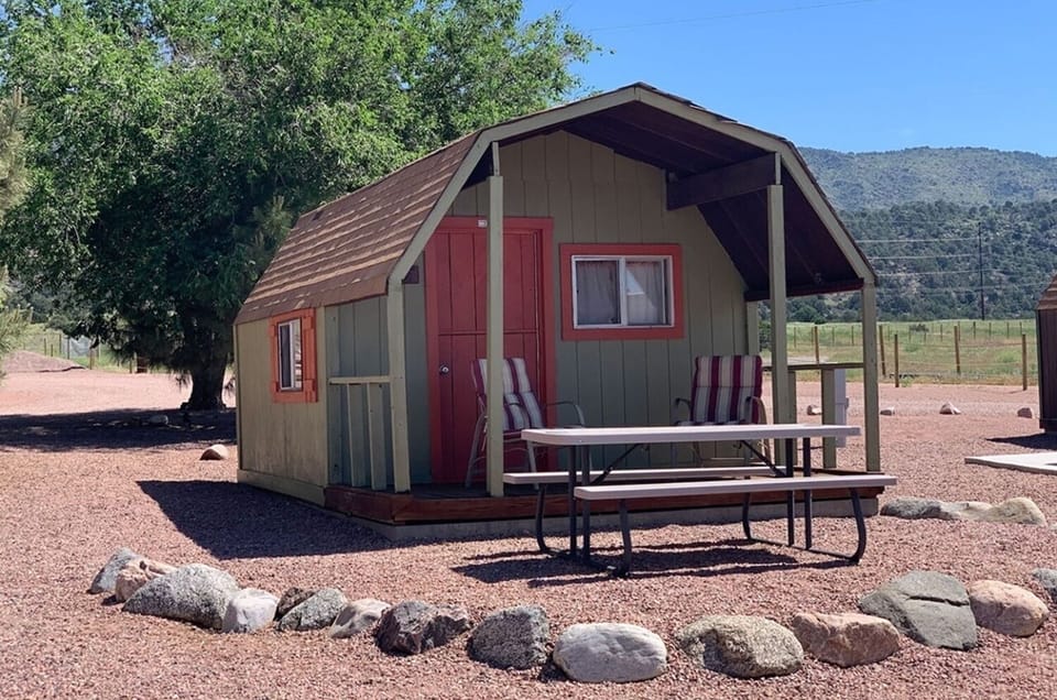 Arrive to your private cabin and relax under the shaded porch.