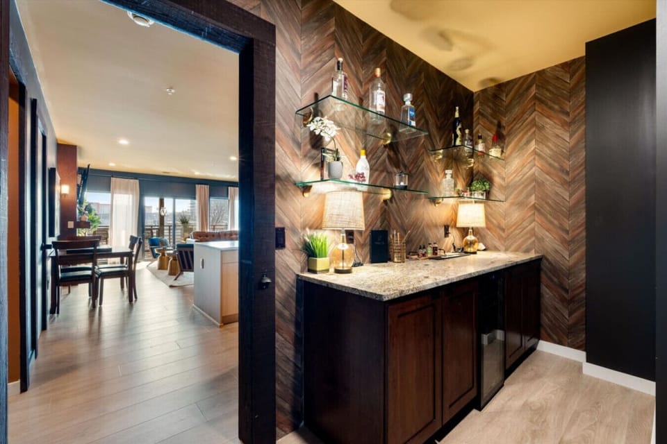 Sleek bar design meets warm ambiance. The perfect spot to relax and enjoy a drink.