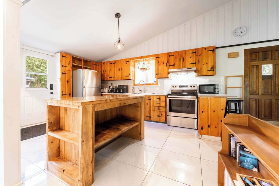     Rustic kitchen with ample counter space and wood cabinetry.