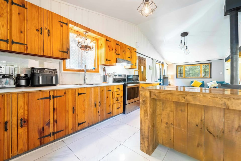     Large country-style kitchen with modern appliances.