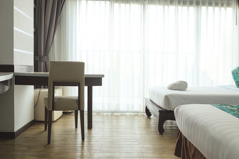 Triple Room, Balcony, City View | In-room safe, desk, laptop workspace, iron/ironing board