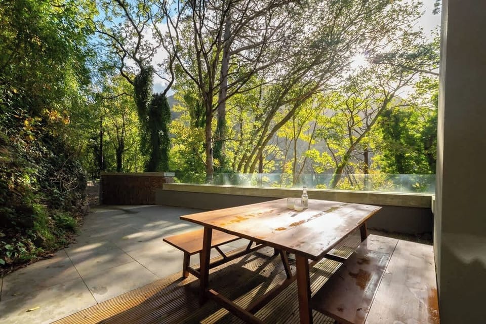 Relax on the spacious patio and soak in breathtaking views of the serene woodlands, where nature meets tranquility