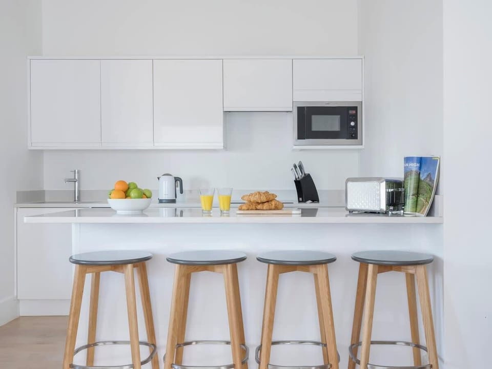 The modern kitchen comes fully equipped with everything you could need for your stay 