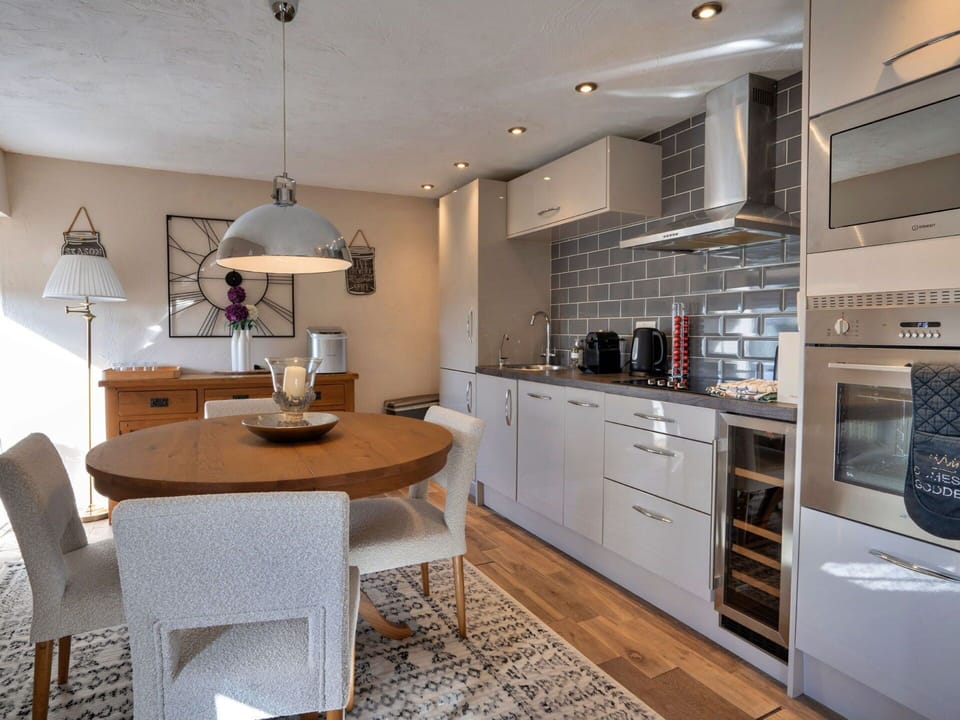 Furniture, Interior Design, Flooring, Cabinetry, Floor, Countertop, Light Fixture, Chair, Kitchen, Wood