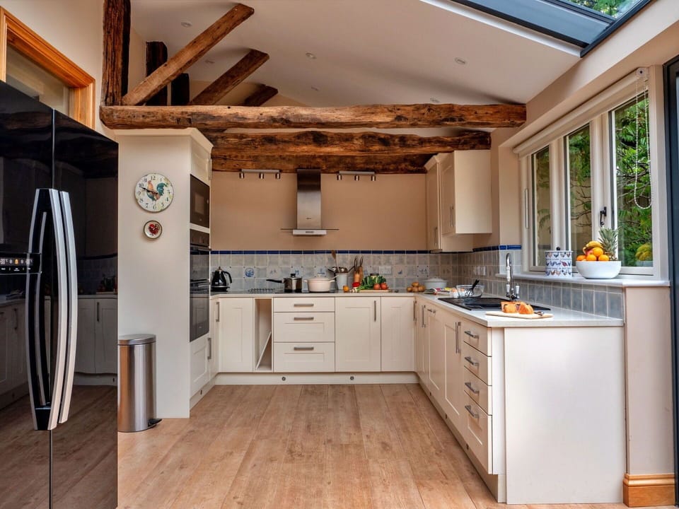 Furniture, Kitchen, Countertop, Interior Design, Kitchen Appliance, Cabinetry, Flooring, Wall, Major Appliance, Wood