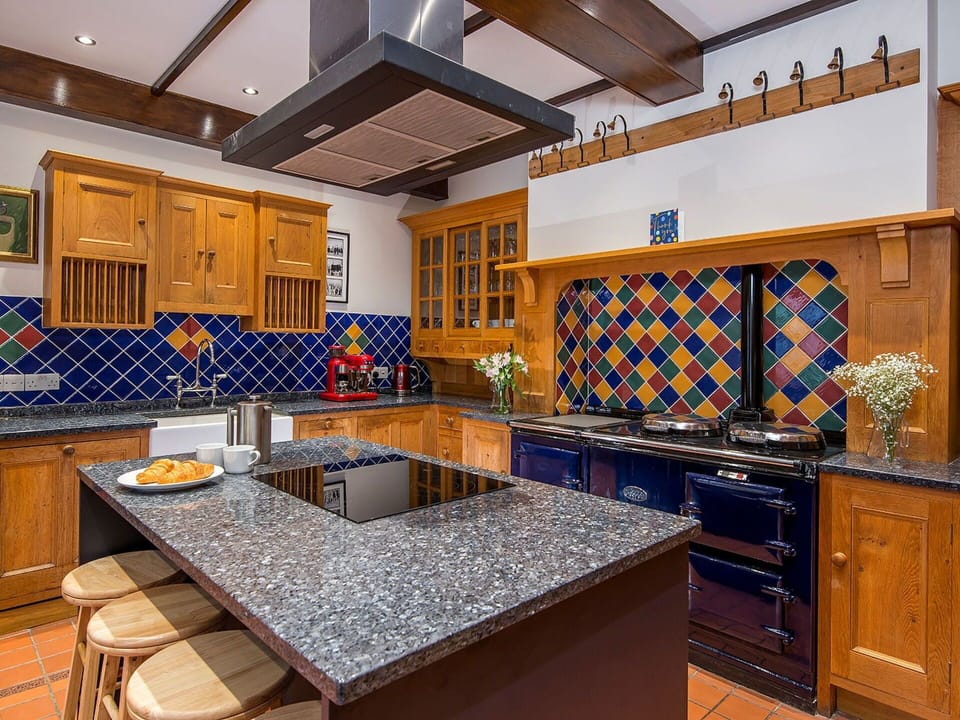 Kitchen, Flooring, Interior Design, Wood, Countertop, Kitchen Appliance, Kitchen Stove, Floor, Cabinetry, Furniture