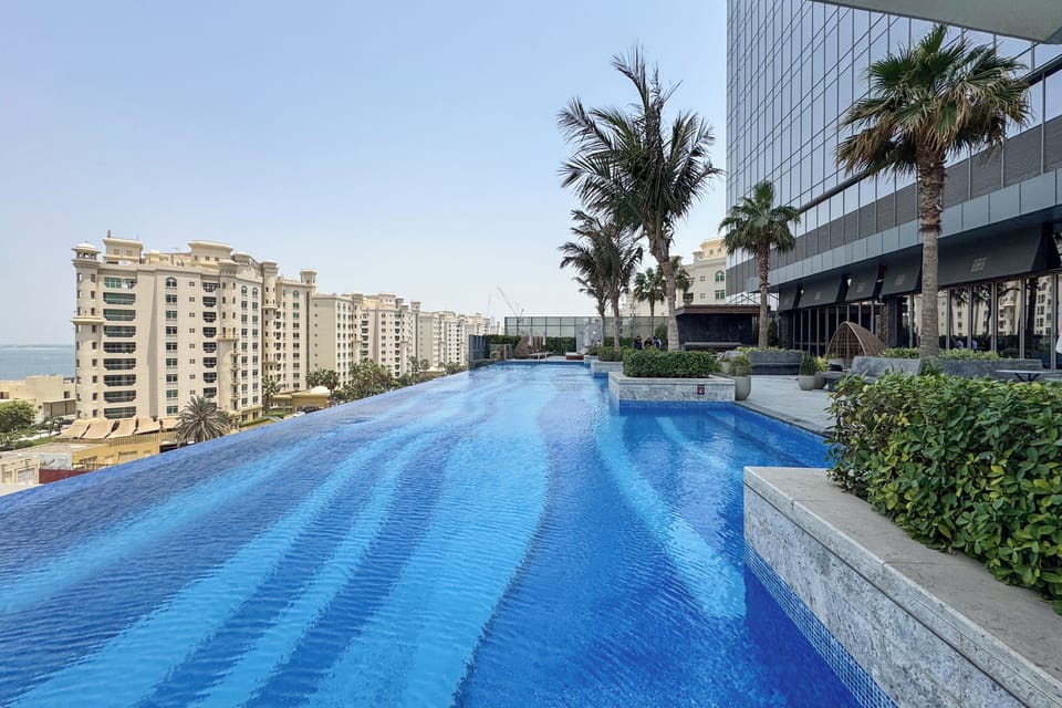 Outdoor pool, open 9:00 AM to 7:00 PM, pool umbrellas, sun loungers