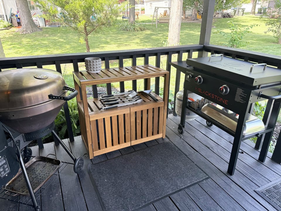 Outdoor prep area includes a griddle, grill, and plenty of outdoor utensils. 